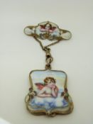 An Art Nouveau brooch set with enamel depicting cherubs with a drop section opening to reveal a