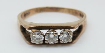 A 9ct gold ring set with three diamonds, total 0.