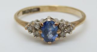 A 9ct gold ring set with an oval cut sapphire of approximately 0.