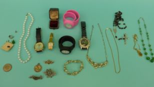 A collection of jewellery to include a 9ct gold brooch, necklaces, watches,