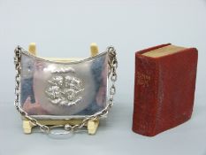 A hallmarked silver bag or book holder containing a miniature hymn book,