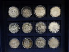 Twelve silver commemorative Ships and Explorers crown sized etc coins in a collector's case,