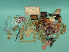 A collection of costume jewellery to include Art Deco earrings, beads,