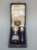 A cased Elkington hallmarked silver christening set together with a silver napkin ring,