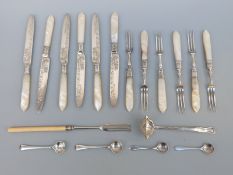 A set of six cake knives and forks with hallmarked silver ferrules,