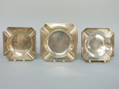 Three various hallmarked silver ashtrays, width of largest 10.
