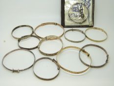 A collection of silver and rolled gold christening bracelets