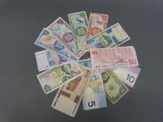 A small collection of bank notes to include Canada 50 dollars, Trinidad and Tobago, Germany, Jersey,