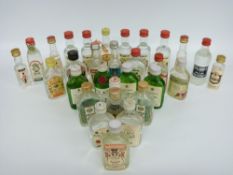 Thirty alcohol miniatures, mostly circa 5cl, including gin, vodka, rum and whisky, Gordon's,