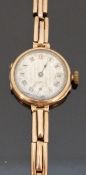 9ct gold ladies wristwatch with subsidiary seconds dial, inset Roman numerals,