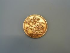 An 1875 gold full sovereign,