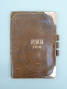 A leather wallet with 9ct gold mounts