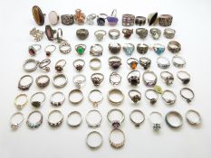 Seventy silver rings including examples set with paste, marcasite, tiger's eye, topaz,