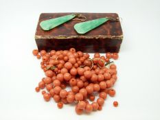 A pair of jadeite style earrings and coral beads