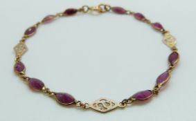 A 9ct gold bracelet set with rubies