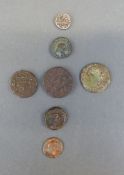 A cache of ancient coins to include Roman etc, and a Middle Eastern silver example, seven in all,