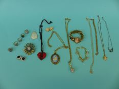 A collection of costume jewellery to include silver ring, a Monet pendant,
