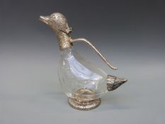 A novelty claret jug formed as a duck,