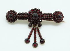 A Victorian brooch set with Bohemian cut garnets,