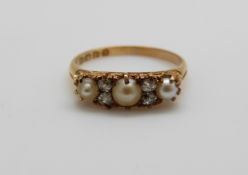 An 18ct gold ring set with three pearls and four old cut diamonds, 3.