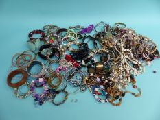 A large quantity of costume jewellery including beads,