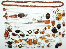 A large quantity of silver pendants, earrings,