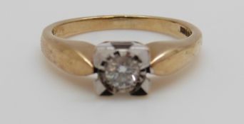 A 9ct gold ring set with a diamond of approximately 0.