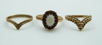 Three 9ct gold rings, one set with an opal surrounded by garnets, 4.