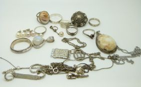 A collection of silver jewellery to include seven rings, pearl set earrings,
