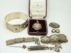 A hallmarked silver bangle, two filigree bracelets, Mordan silver pencil, Victorian brooch,