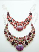Two silver necklaces set with faux garnets and coral