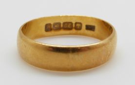 A 22ct gold wedding band, 5.