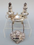 A pair of hallmarked silver salts, a silver mustard and a hallmarked silver Sherry bottle ticket,