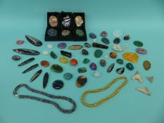 A collection of gemstones including jet, hematite, jade, agate, jasper,