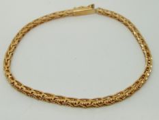 A yellow metal bracelet marked 750, 8.
