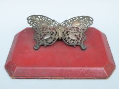 A Victorian hallmarked silver novelty desk paperclip formed as a butterfly,