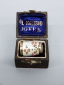 A white metal floral guilloché enamel thimble marked 835S in case
