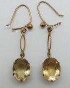 A pair of 9ct gold earrings set with citrines