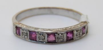 An 18ct white gold ring set with square rubies and diamonds (size N)