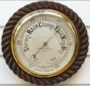 Negretti & Zambra of London barometer in oak rope twist surround,