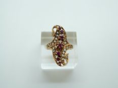 An Eastern gold ring set with rubies and point cut diamonds, 4.