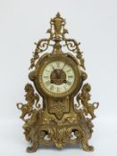 A brass 19thC Cartel style cast French mantel clock in 18thC style,
