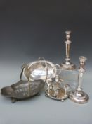 Two swing-handled bowls, one silver plated, the other pewter, a pair of candlesticks,