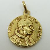 An 18ct gold pendant in the form of a coin, 3.
