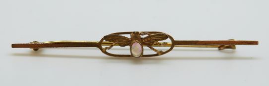 A 9ct gold brooch set with an opal cabochon in the form of an insect, 2.