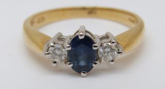 An 18ct gold ring set with an oval cut sapphire of approximately 0.