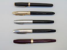 Five Sheaffer fountain pens including three White Dot examples,