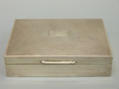 A hallmarked silver cigarette box with engine turned lid, Birmingham 1959 maker D Bros,