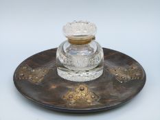 A Victorian turned coromandel inkstand with decorative gilt metal mounts and cut glass inkwell,