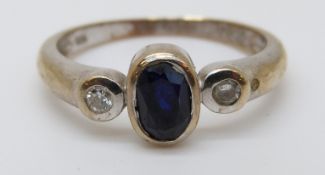 A 9ct gold ring set with an oval sapphire of approximately 0.
